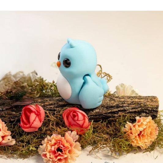 Blue flexible bird figurine with wings