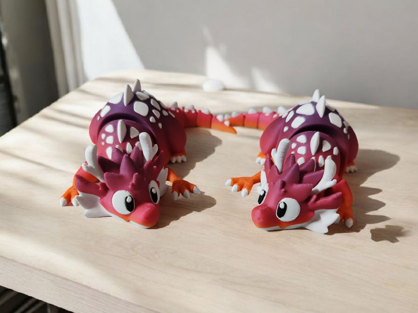 Large rainbow colored dragon with articulated wings and body