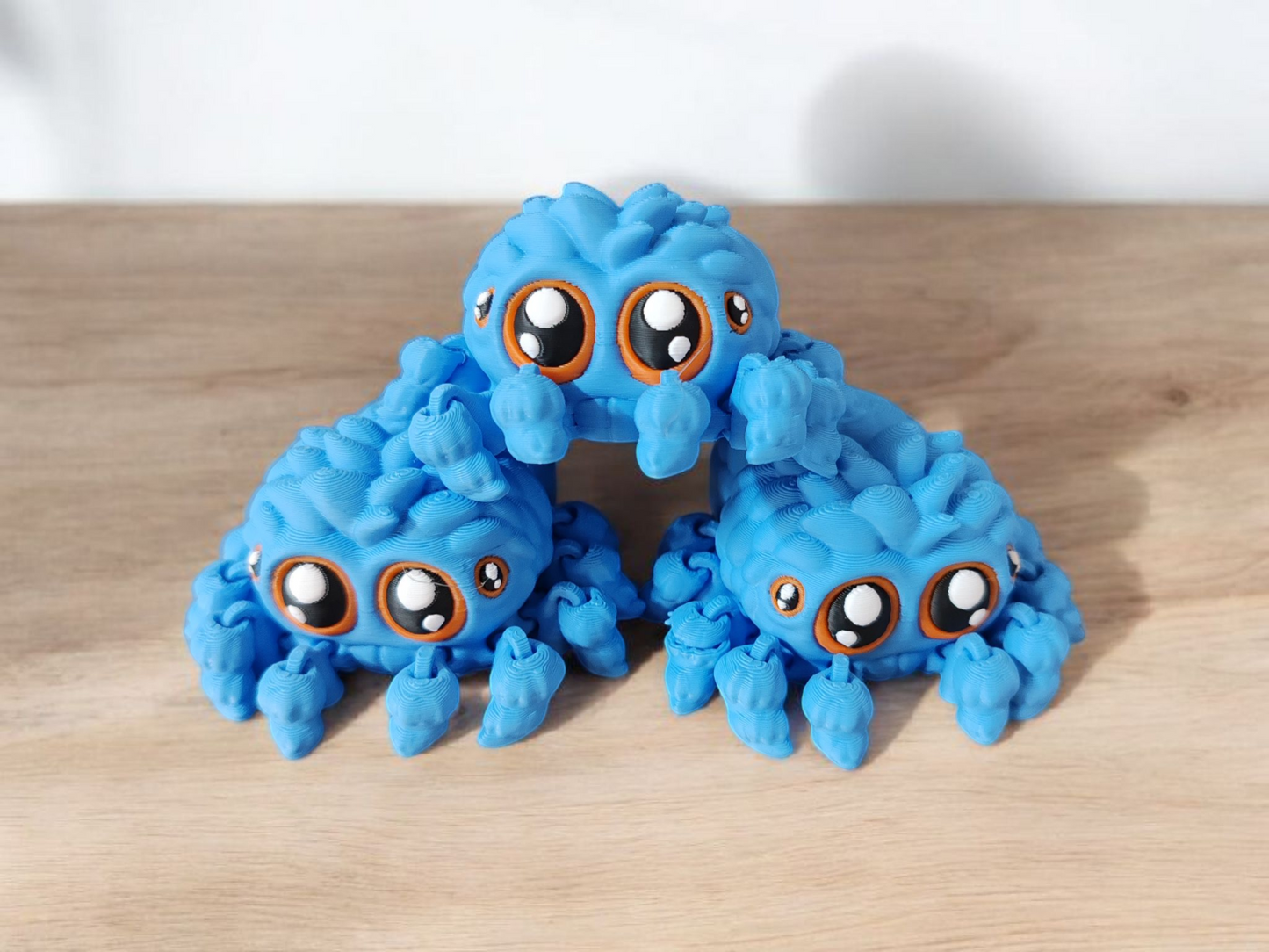 Blue spider with eight long articulated legs