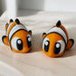 Orange and white articulated Nemo clownfish toy