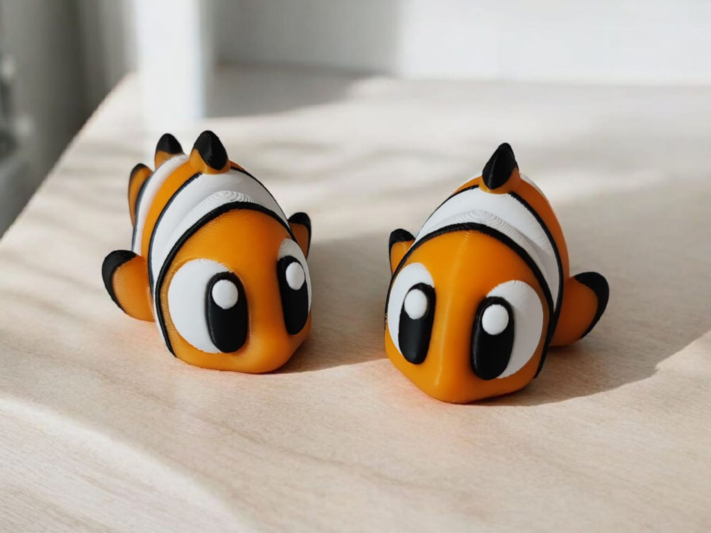 Orange and white articulated Nemo clownfish toy