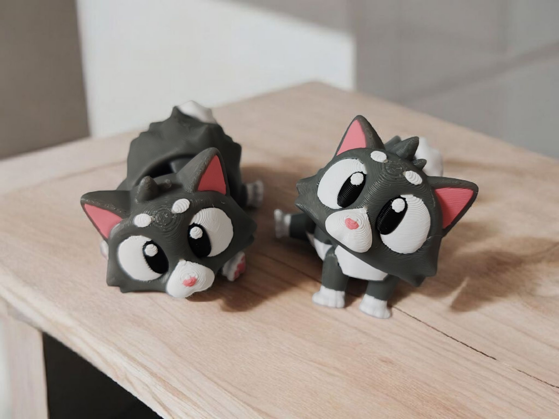 Grey tabby cat with articulated legs and flexible tail