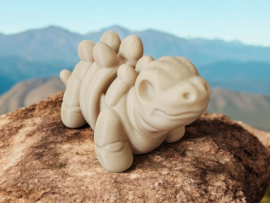 White Stegosaurus dinosaur skeleton with back plates and articulated tail