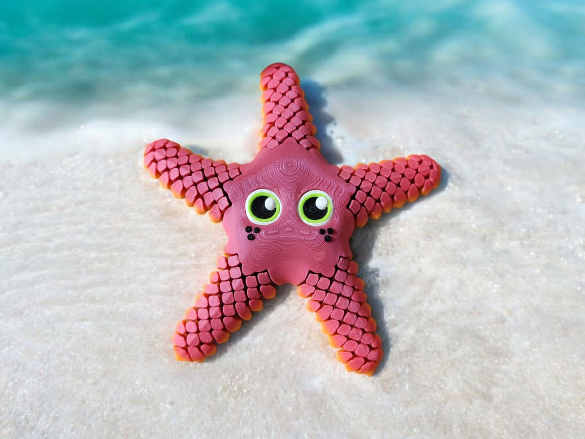 Large orange articulated starfish with five flexible arms