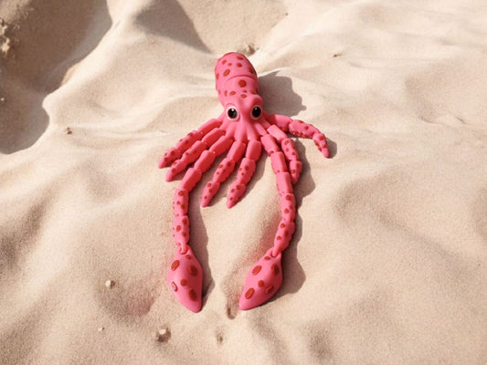 Red articulated squid with long flexible tentacles