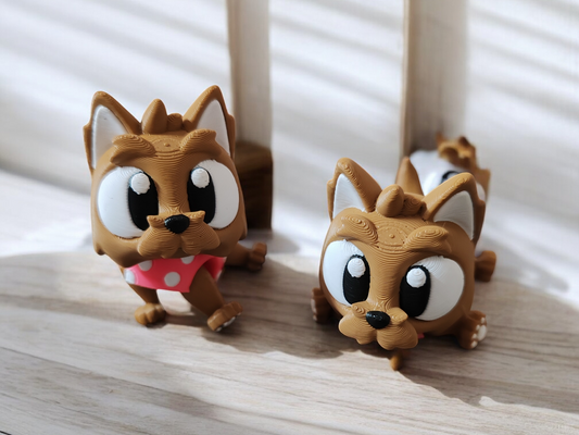 Small brown Yorkshire Terrier dog with articulated body