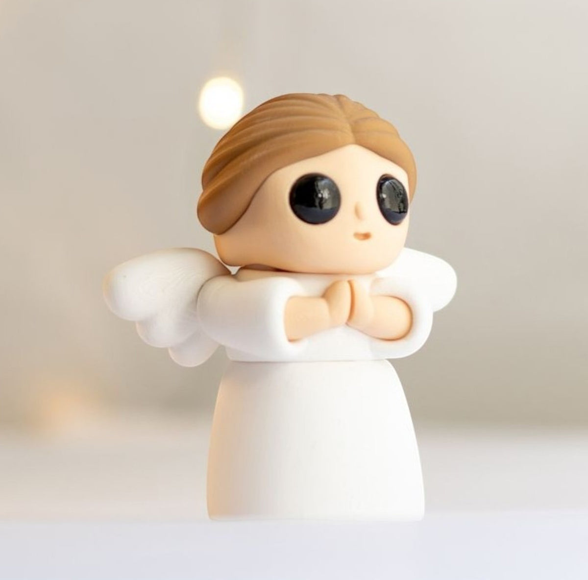 White flexible angel figurine with wings