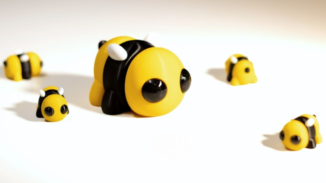 Yellow and black flexible bee figurine with wings