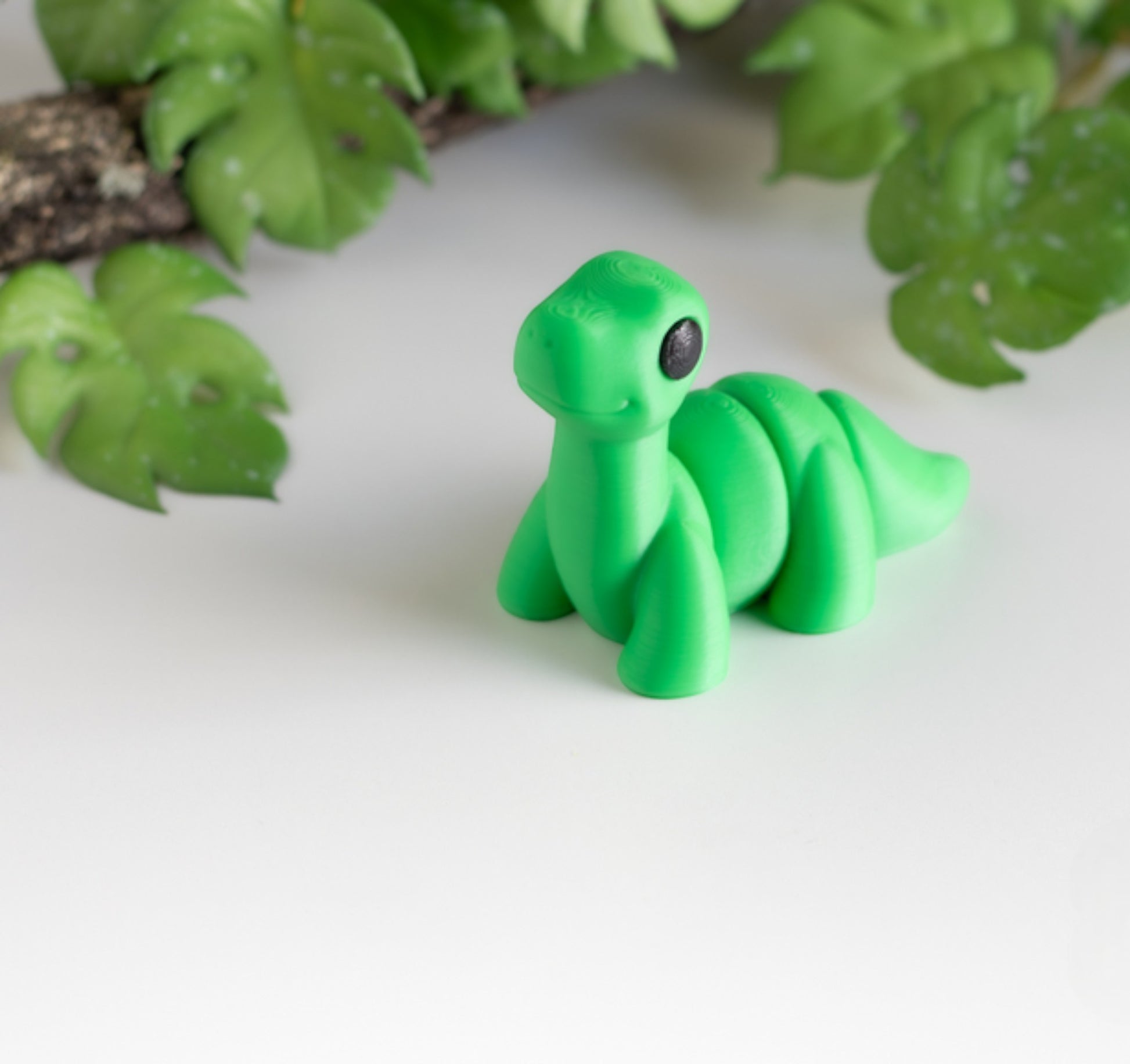 Green flexible Brontosaurus dinosaur figurine with long neck