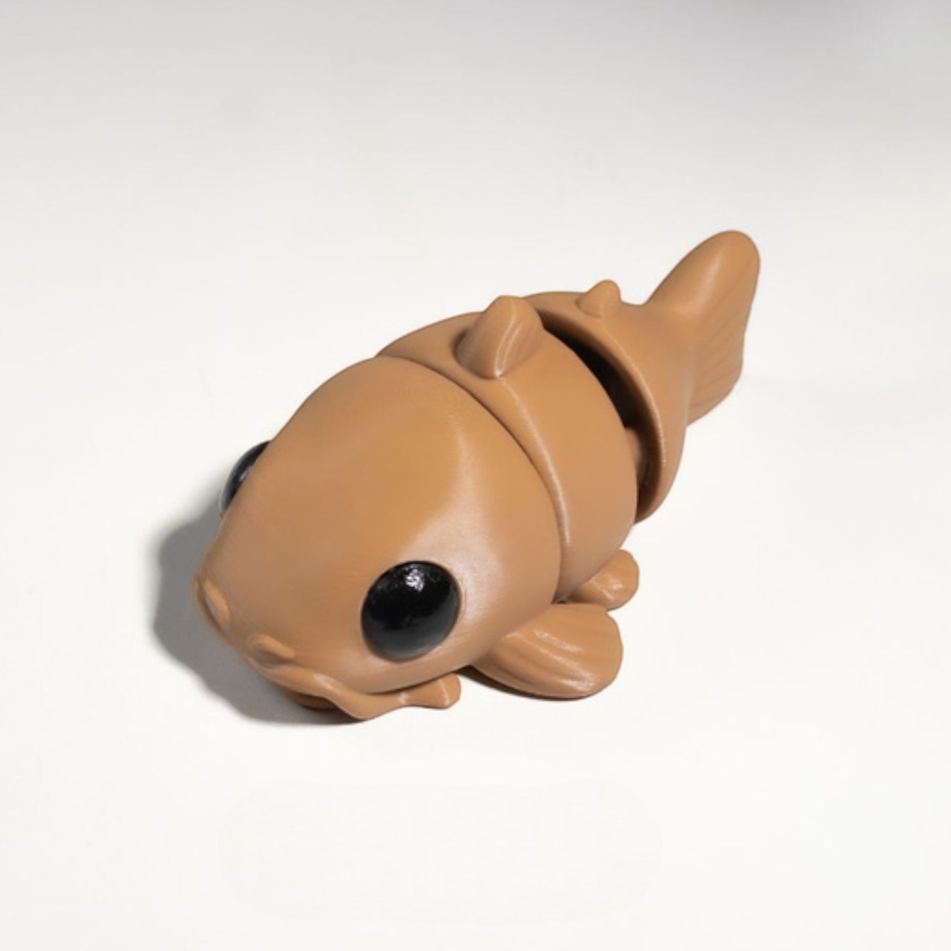 Gray flexible catfish figurine with whiskers