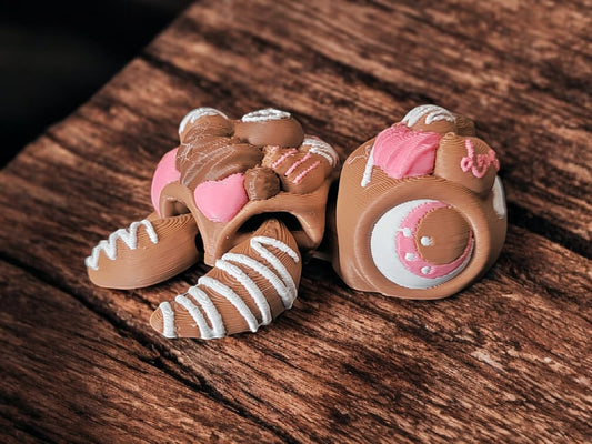 Brown chocolate-themed articulated turtle collectible with flexible shell