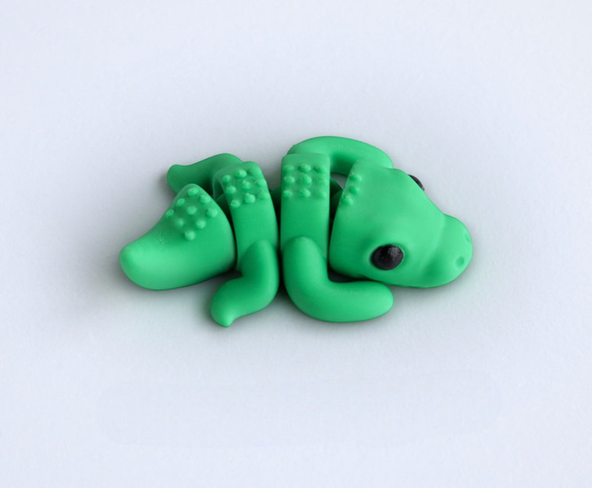 Gray flexible crocodile figurine laying pose