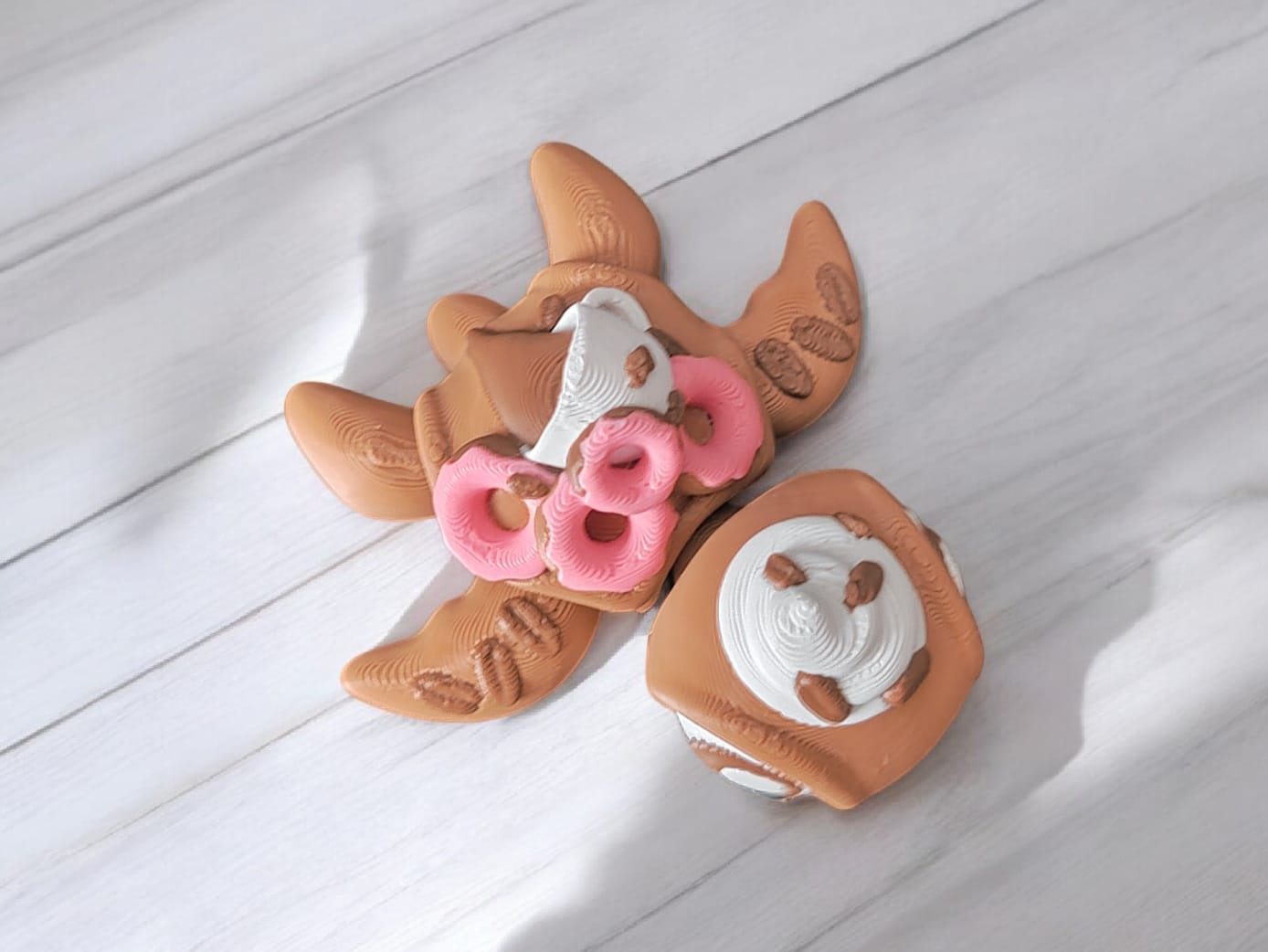 Side view of coffee and donut turtle collectible figure