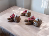 Three coffee and donut themed articulated turtles with brown and pink colors