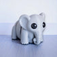 Gray flexible elephant figurine with moveable trunk
