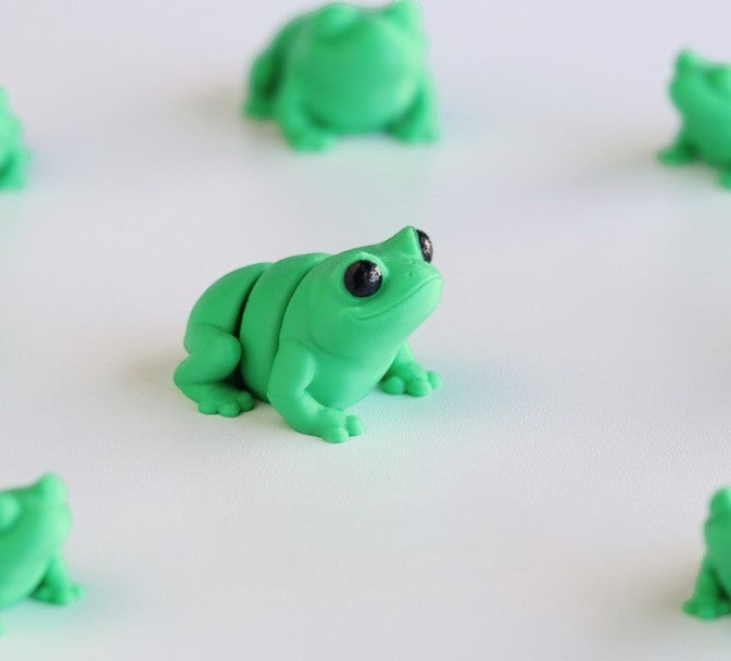 Green flexible frog figurine in sitting pose