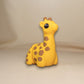 Yellow flexible giraffe figurine with long articulated neck