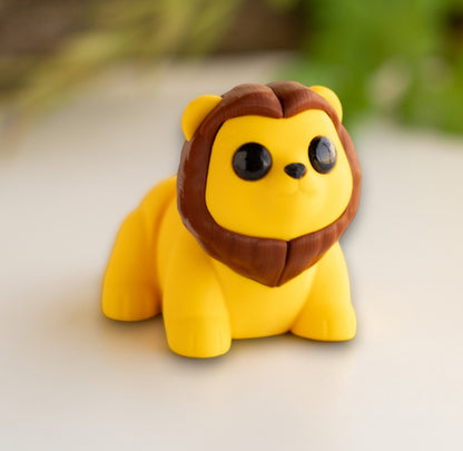 Orange flexible lion figurine with articulated body