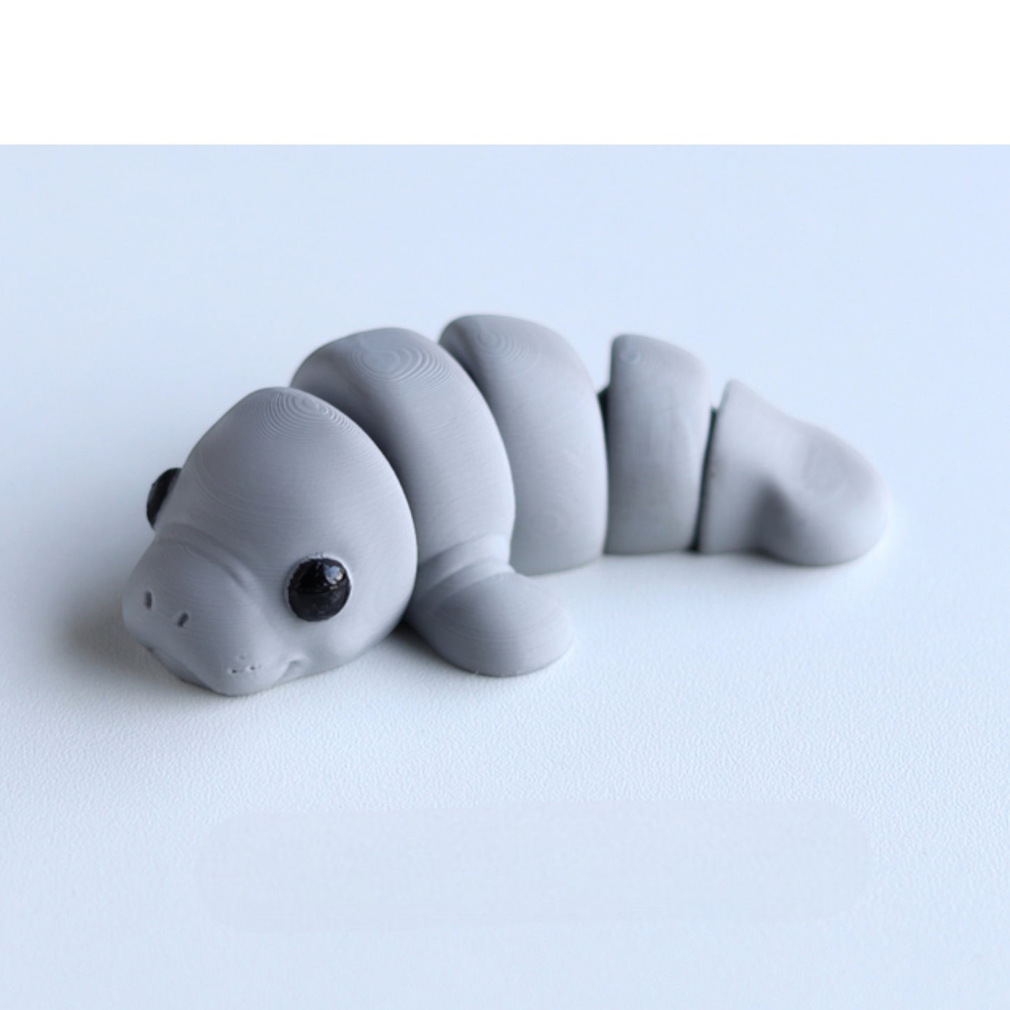 Gray flexible manatee figurine