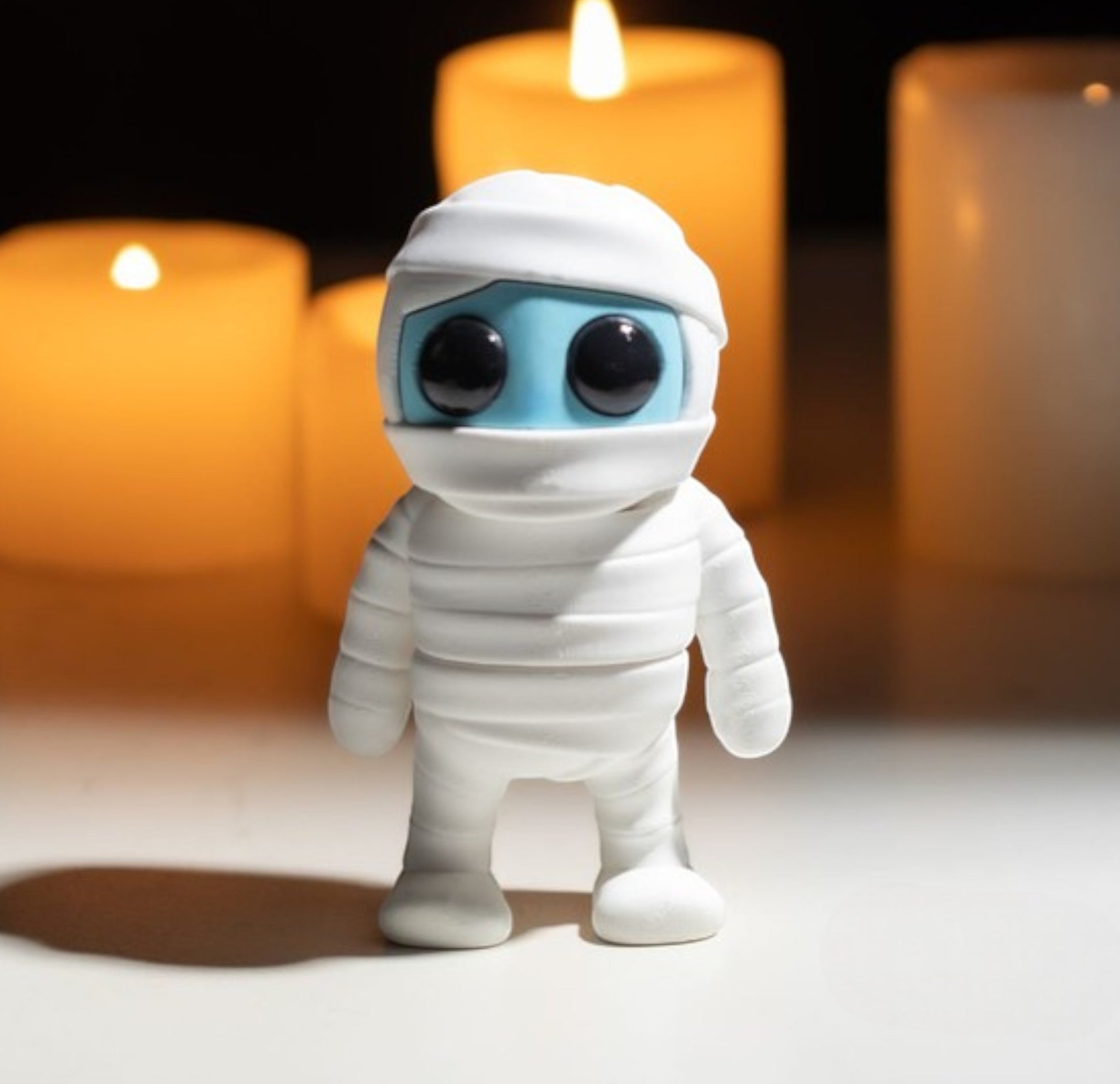 White flexible mummy figurine wrapped in bandages