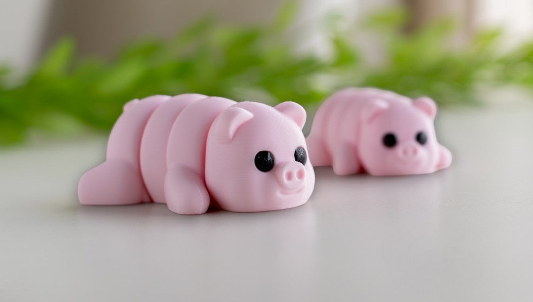 Pink flexible pig figurine with articulated joints