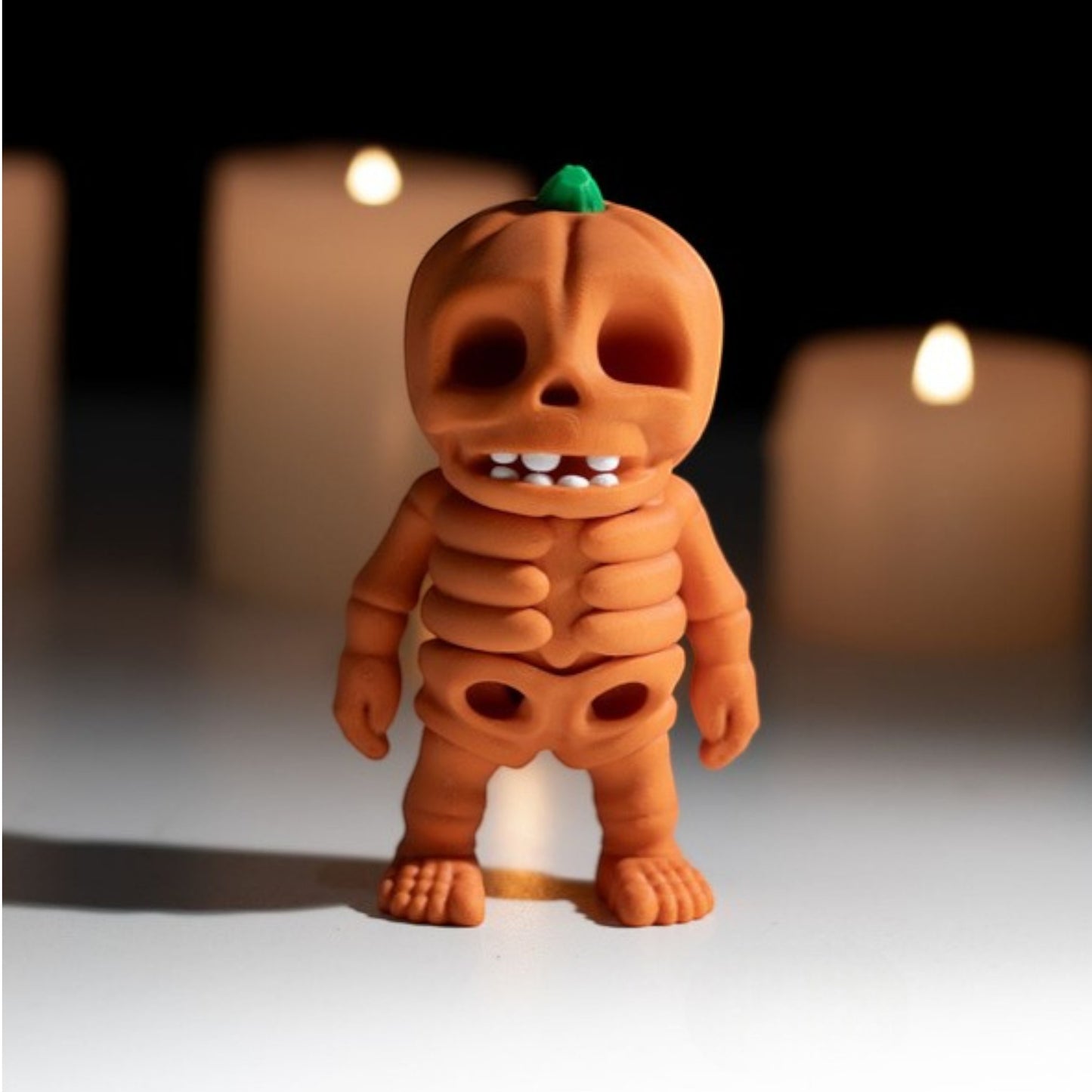 Orange pumpkin skeleton figurine for Halloween