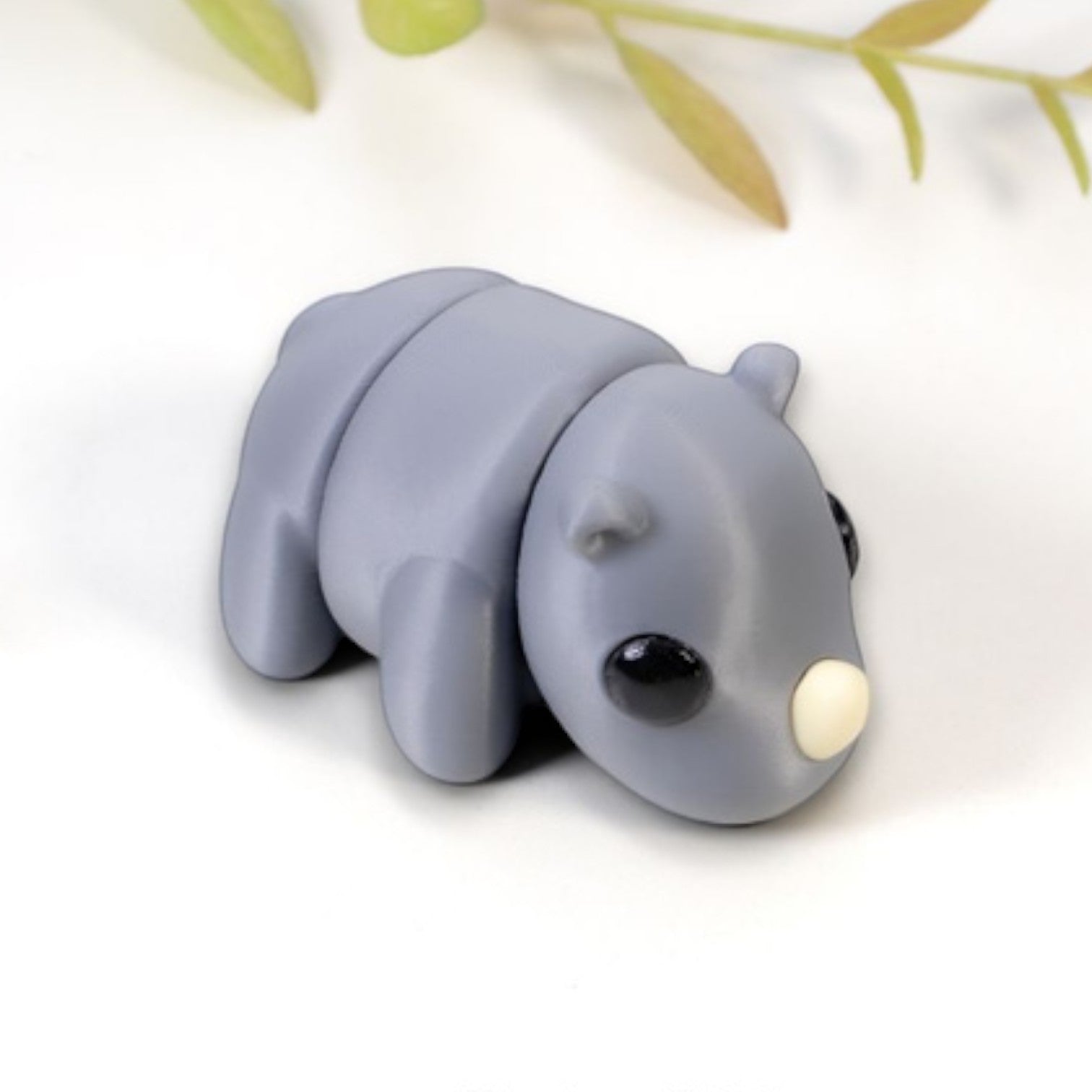 Gray flexible rhino figurine with articulated joints
