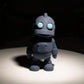 Gray flexible robot figurine with articulated joints