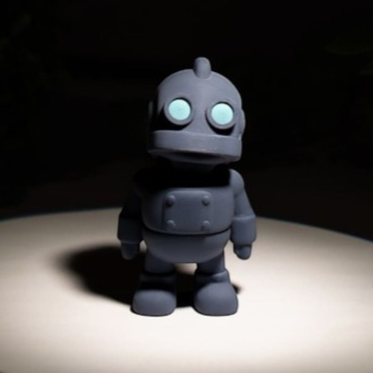 Gray flexible robot figurine with articulated joints