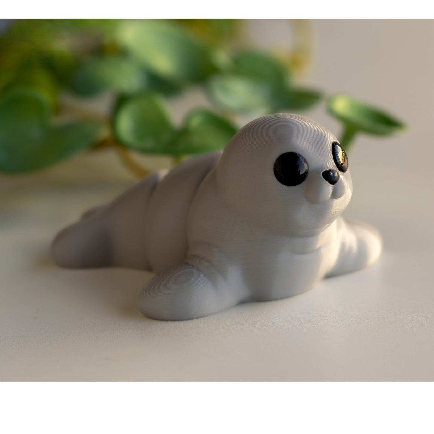 Gray flexible seal figurine in swimming pose