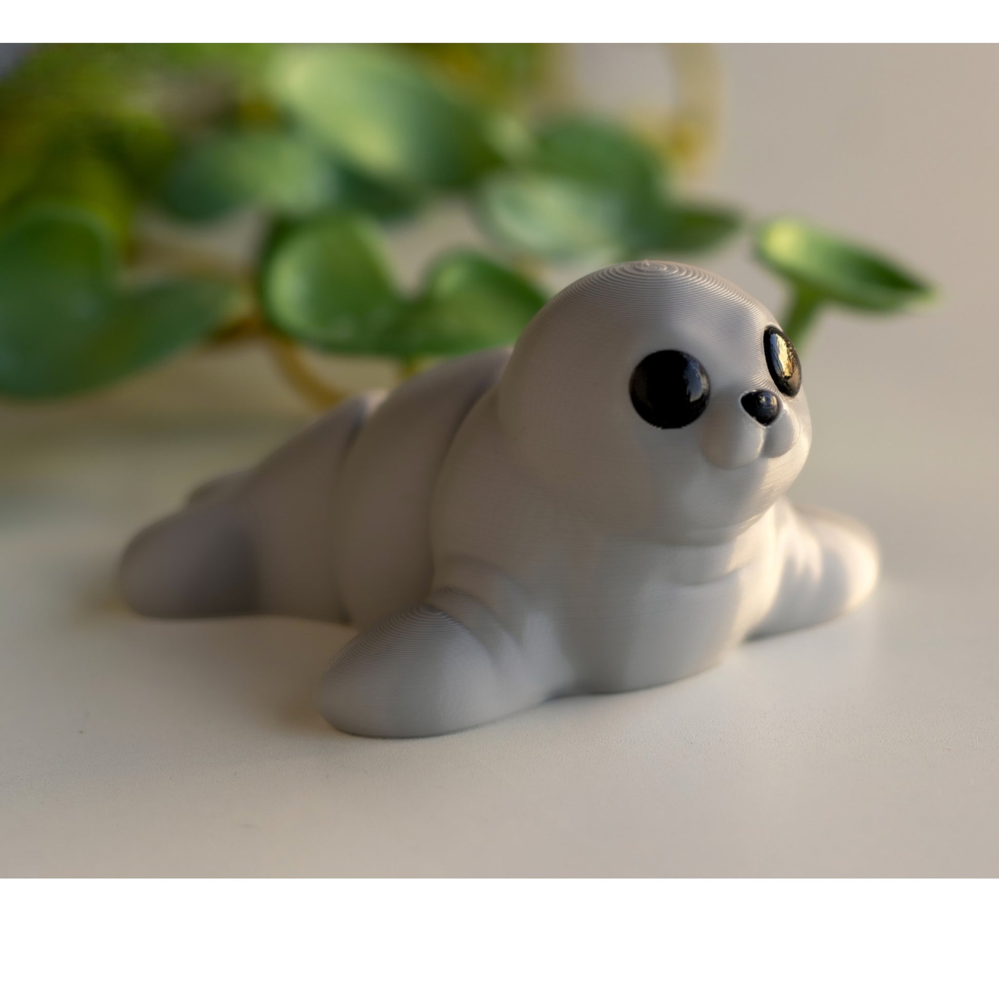 Gray flexible seal figurine in swimming pose