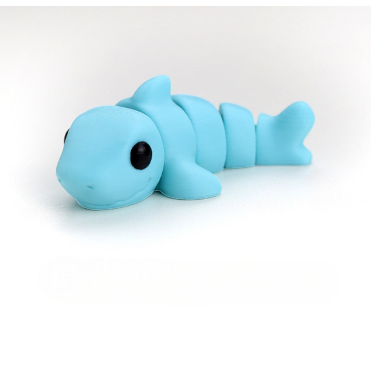 Gray flexible shark figurine with fins
