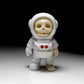 White skeleton astronaut figurine in space suit