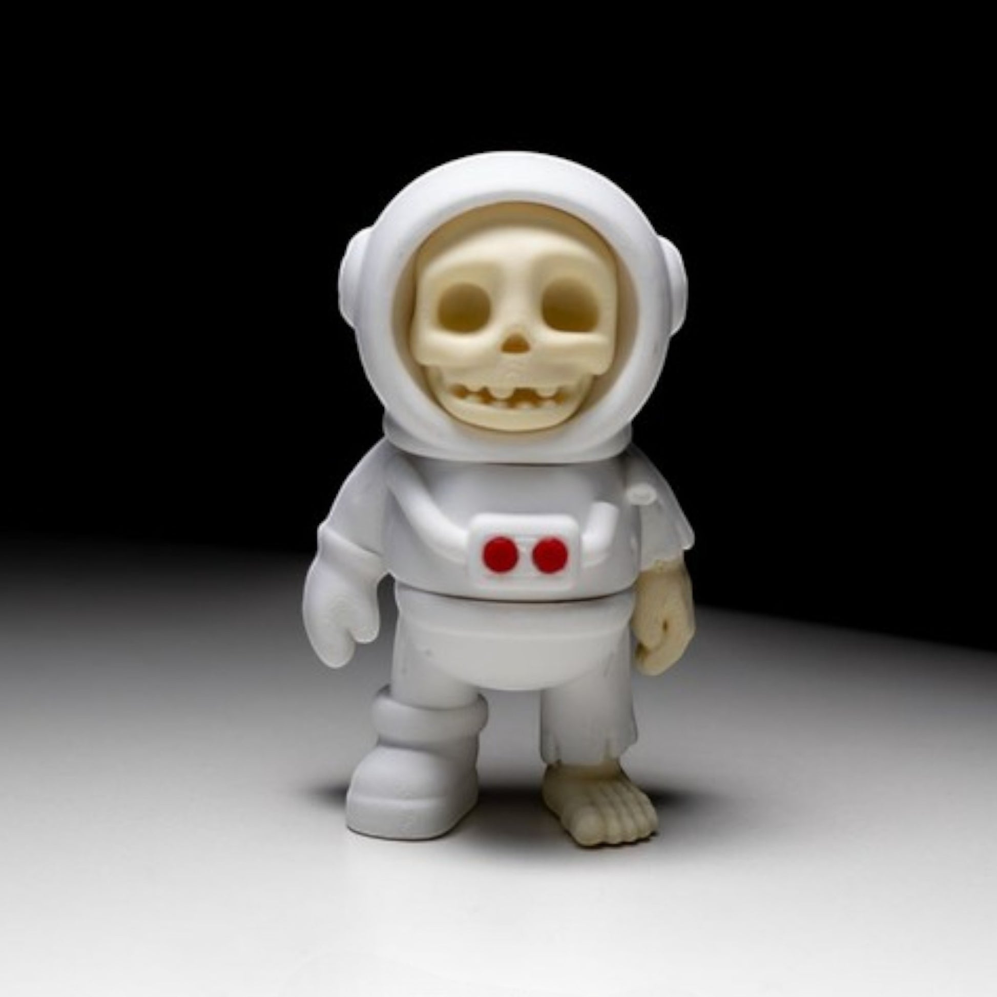 White skeleton astronaut figurine in space suit