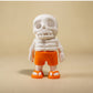 White skeleton figurine wearing sunglasses and lei
