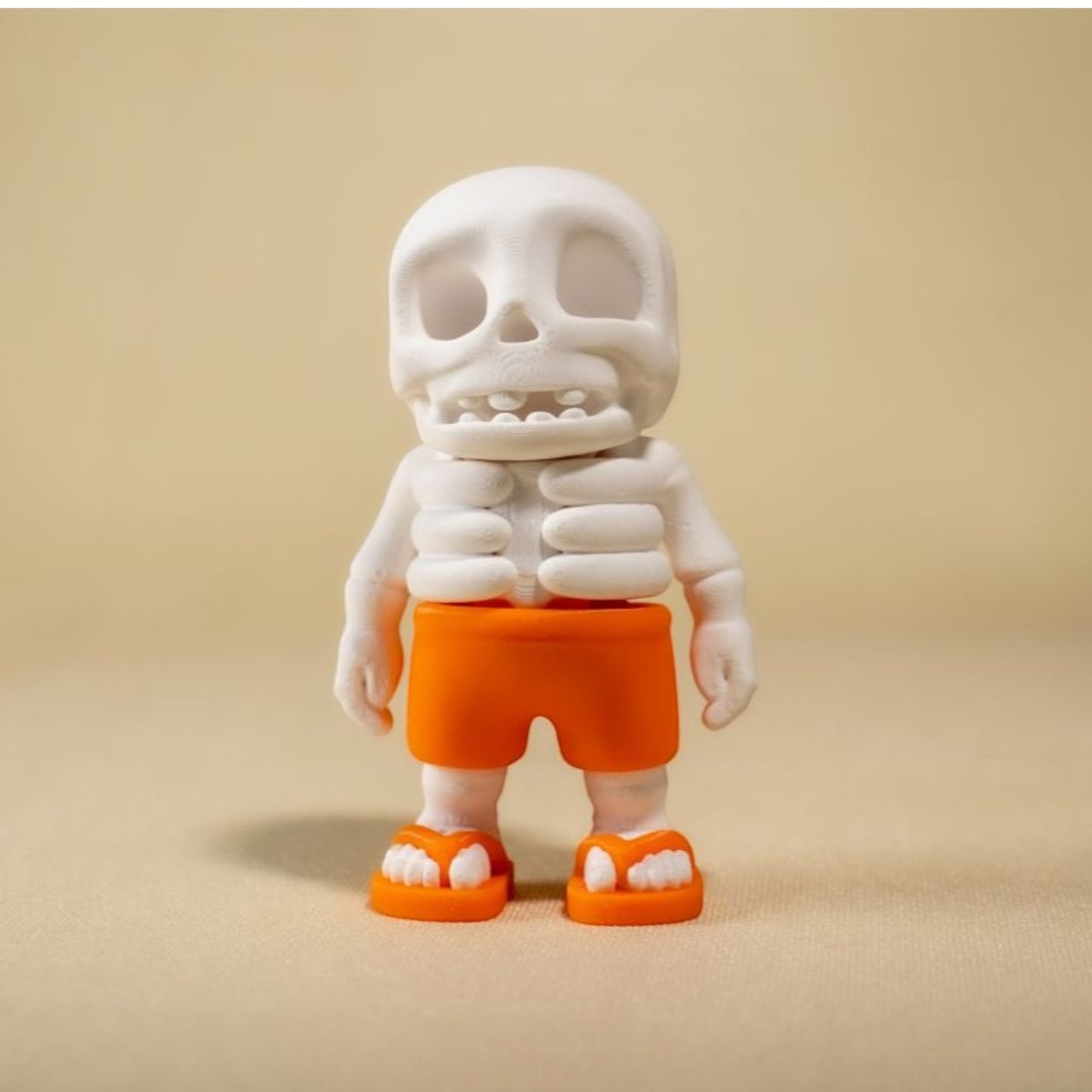 White skeleton figurine wearing sunglasses and lei