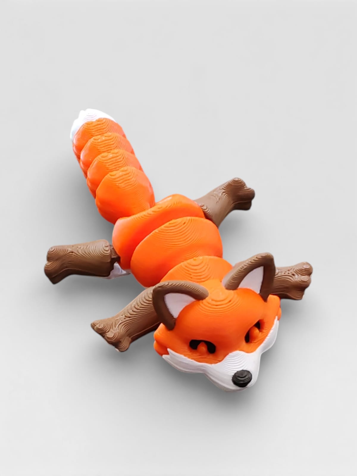 Fox figurine display options with trash can and tree stump