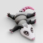 Gray possum on display base showing poseable design